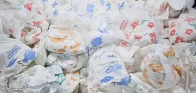 Pile of used baby diapers scrap collected for recycling