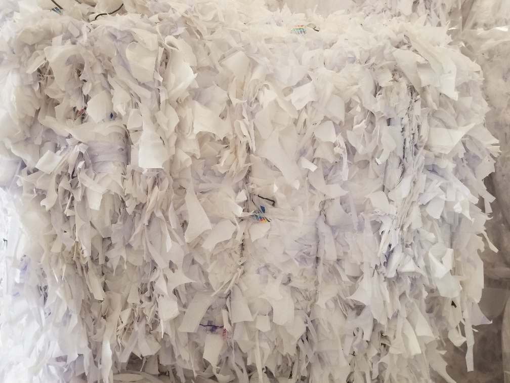 Close up of compressed white LDPE plastic film bale