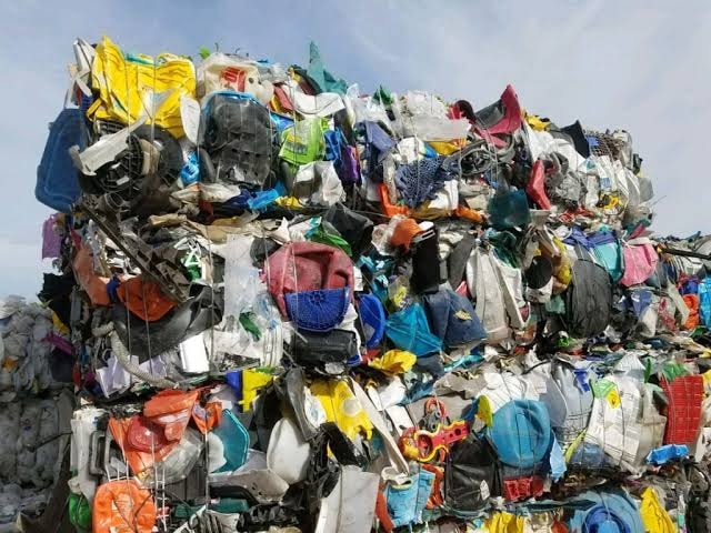 Large bale of compressed mixed colour plastic waste scrap